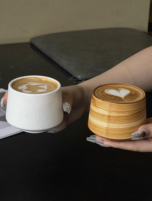 Ceramic coffee cup with comfortable two-handed grip - ergonomic dinnerware design
