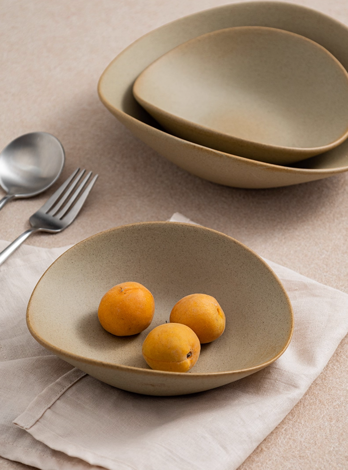 Clay Series tan deep plate with organic shape, photo 5 – Simple Palette Singapore