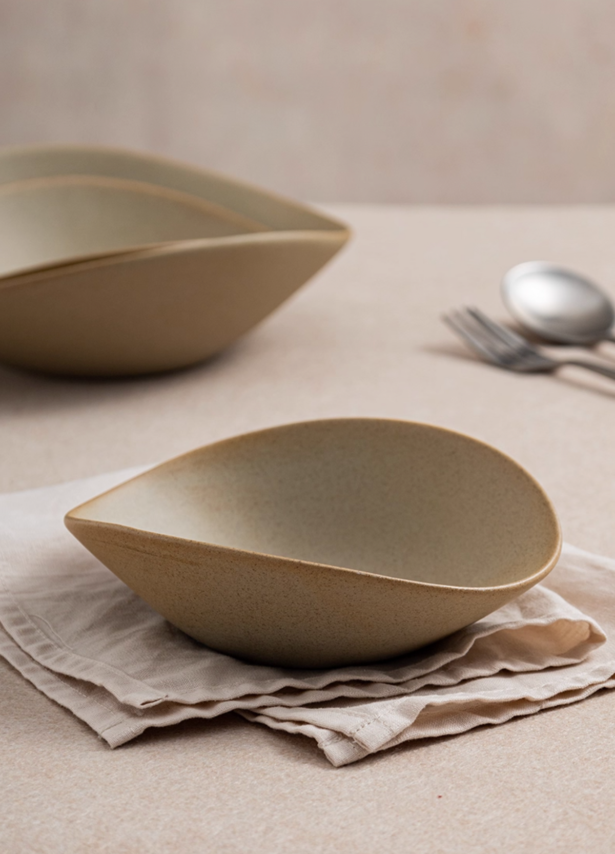 Clay Series tan deep plate with organic shape, photo 2 – Simple Palette Singapore