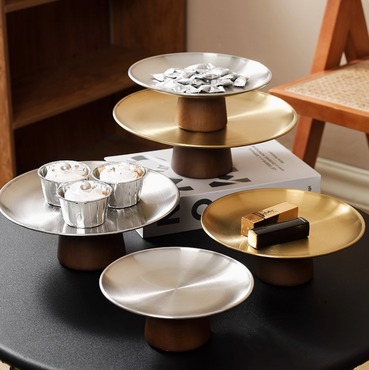 Elegant serving platter stand in modern dining setup with ceramic dinnerware
