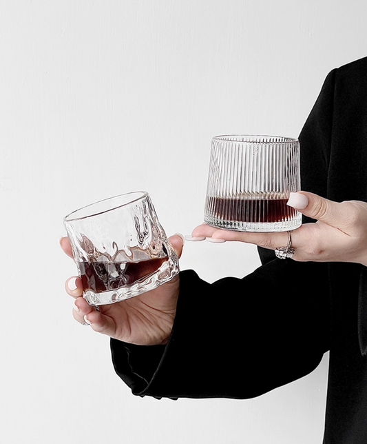 Hand holding a Simple Palette textured drinking glass, showing scale and grip