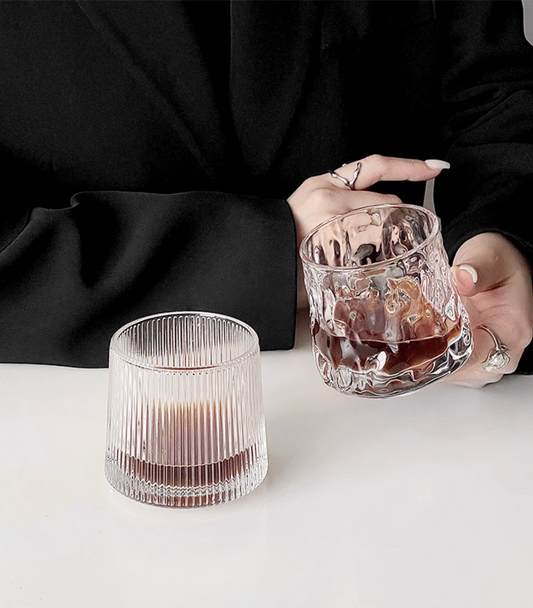 Hand holding a Simple Palette drinking glass, comfortable everyday grip